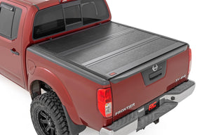 Rough Country Hard Fold Aluminum Tonneau Cover for 2005-2021 Nissan Frontier 5' Bed
