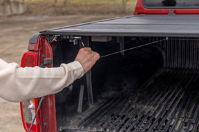 Rough Country Hard Fold Aluminum Tonneau Cover for 2005-2021 Nissan Frontier 5' Bed